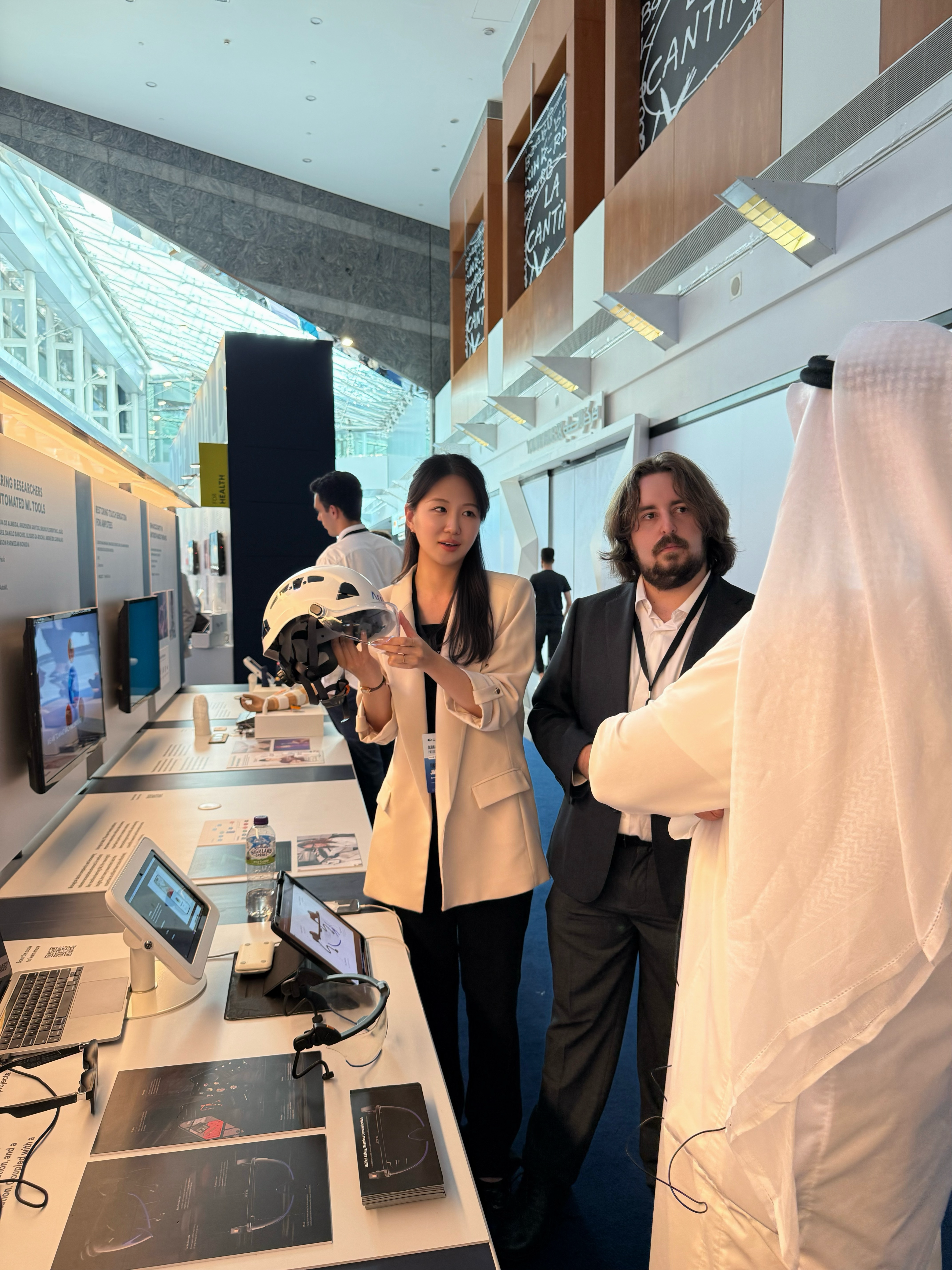 Presenting the Argus visor to a visitor at Prototypes for Humanity in Dubai